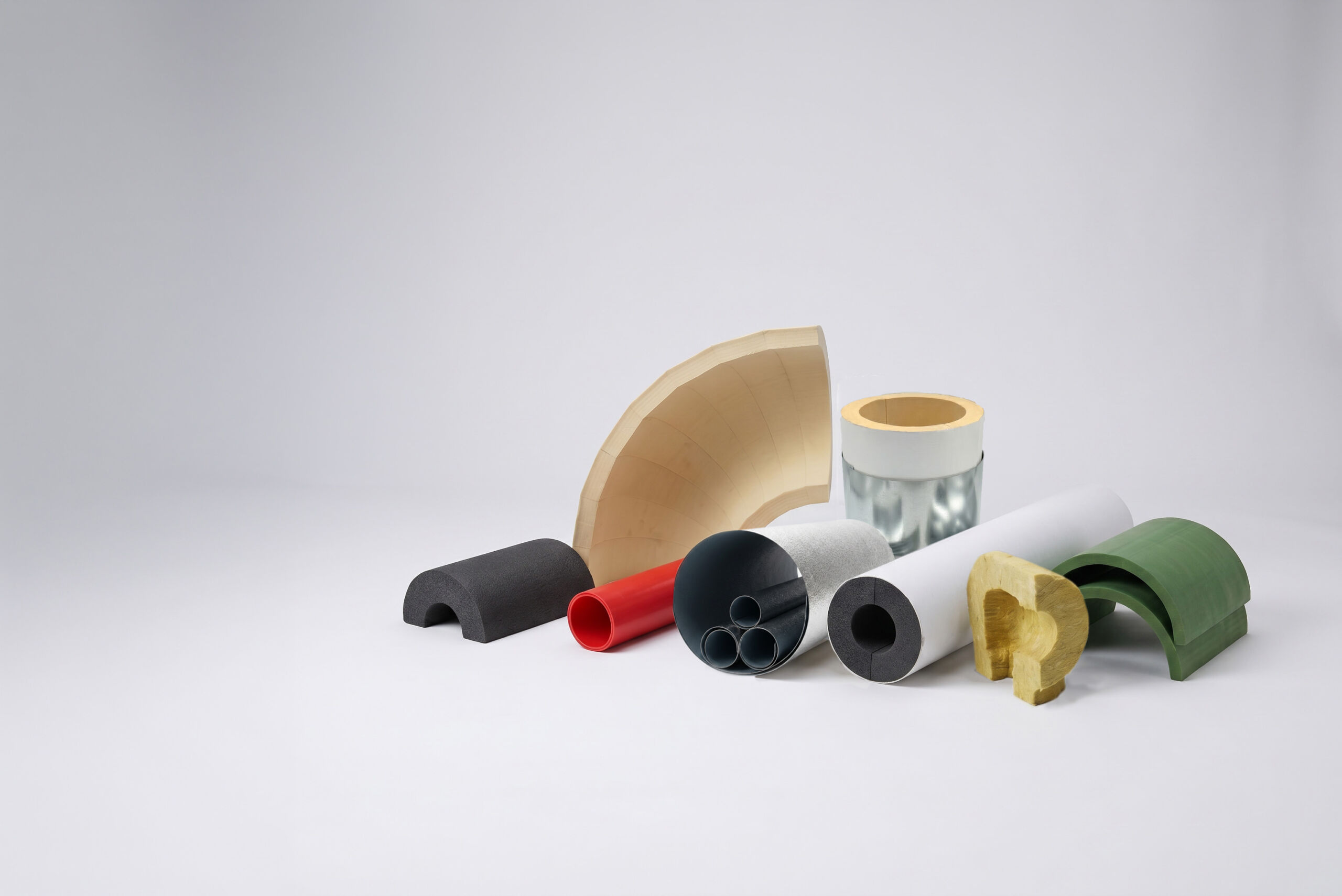 Composite arrangement of Alliance Fabrication insulation products in various materials and colors.